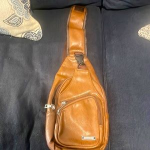 This stylish crossbody sling backpack is a perfect for men/women on the go.